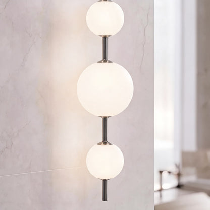 Vertical Globe Wall Light Glass Shade Brass LED Sconce
