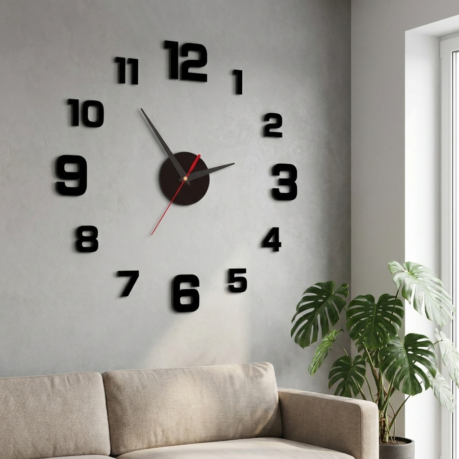 Black frameless wall clock on a living room wall