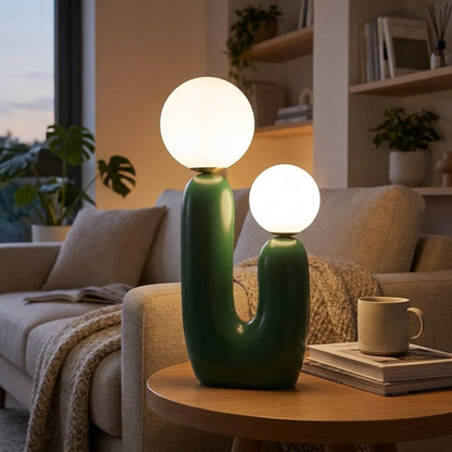 Nordic glass table lamp green glass glowing on a side table