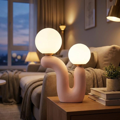 Nordic glass table lamp pink glass glowing on a side table