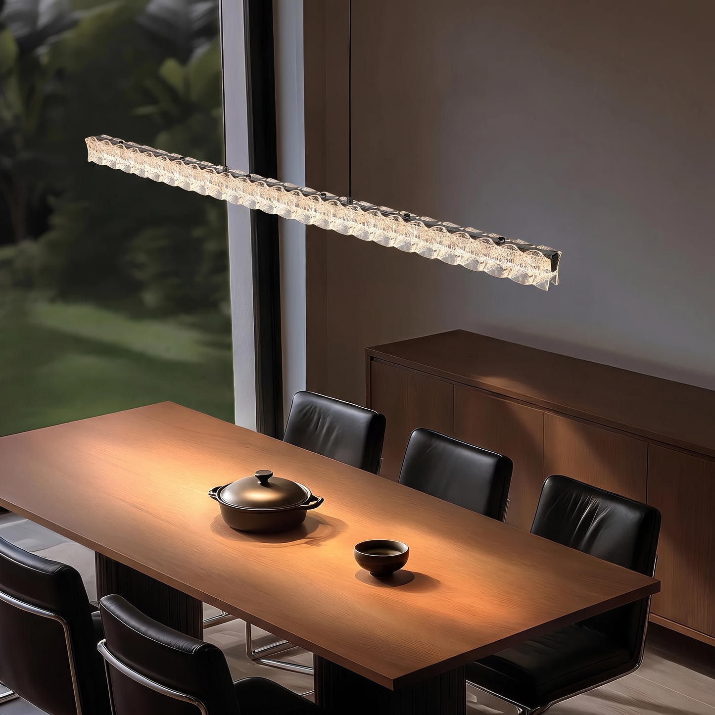 Pearl Black 100cm Italian linear crystal LED pendant light above a dining table