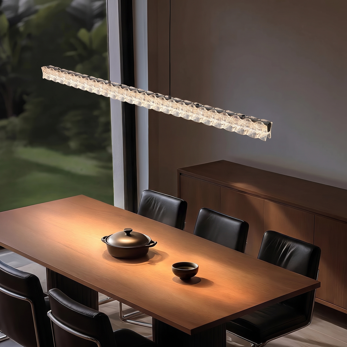 Pearl Black 100cm Italian linear crystal LED pendant light above a dining table