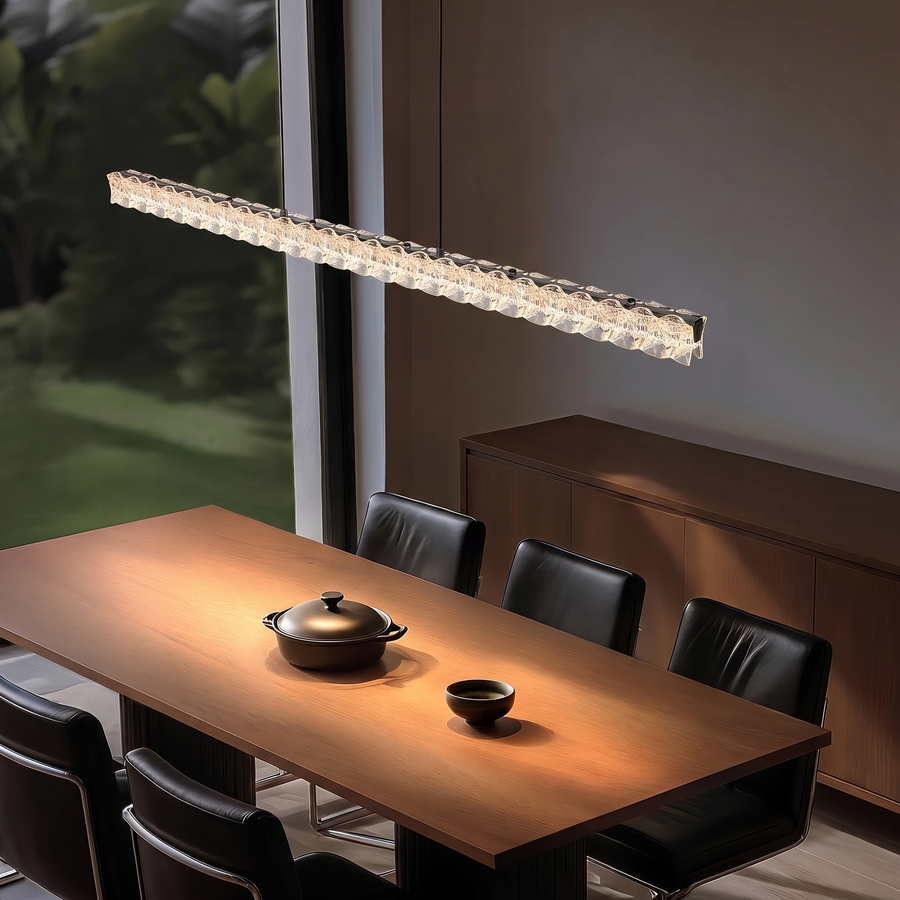 Pearl Black 100cm Italian linear crystal LED pendant light above a dining table