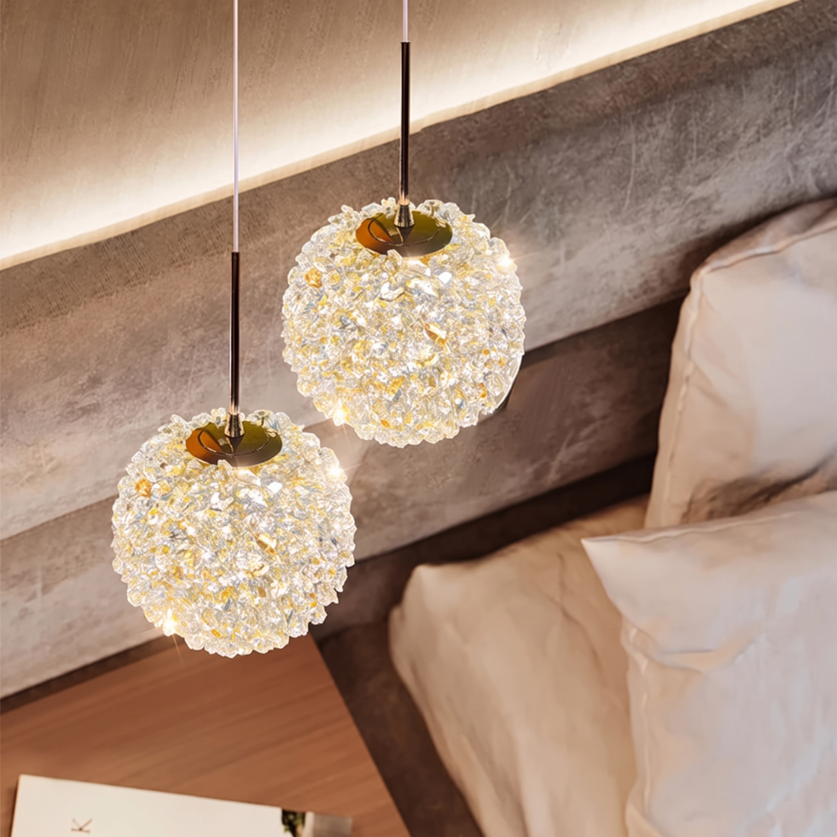 Double 15cm crystal ball pendant light beside a bed