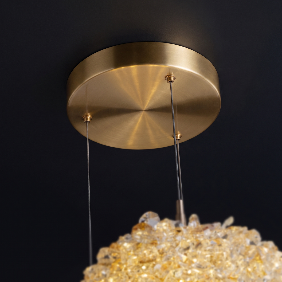 Crystal ball pendant light - close-up of the brass ceiling canopy and suspension cables