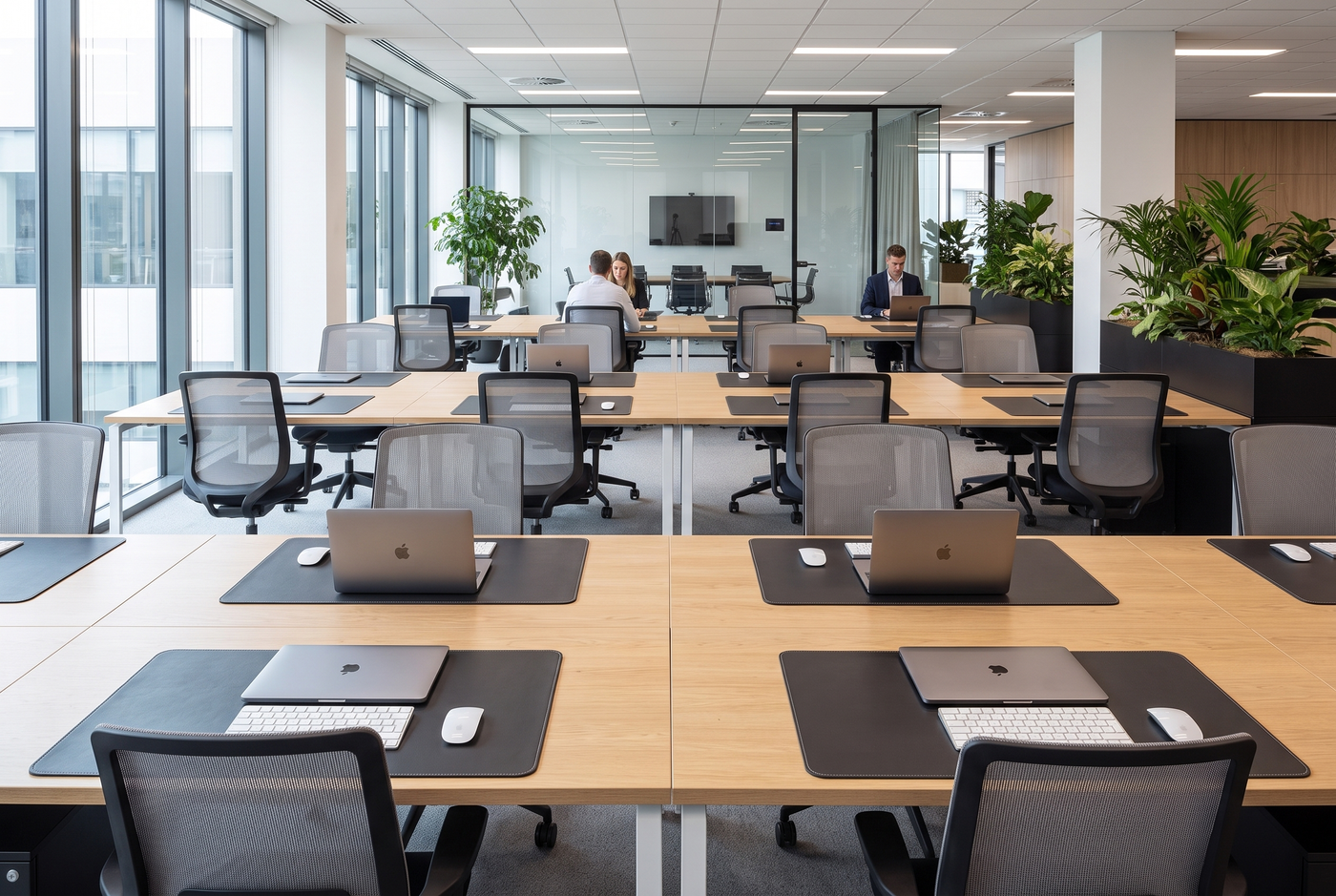 Wrkspace Co PU leather desk mats on every desk in a corporate open-plan office
